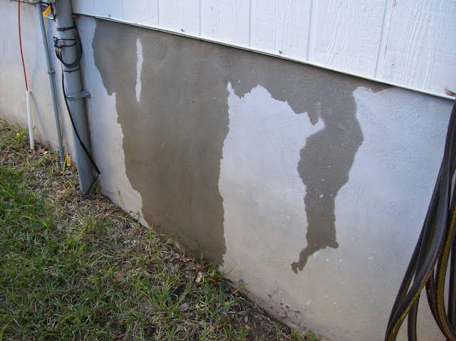 Water seepage visible on an exterior foundation wall